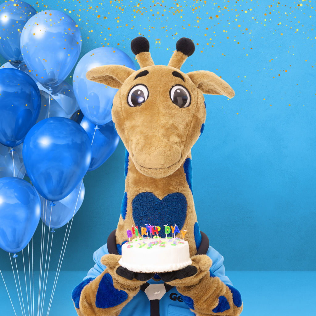 George the giraffe with birthday cake